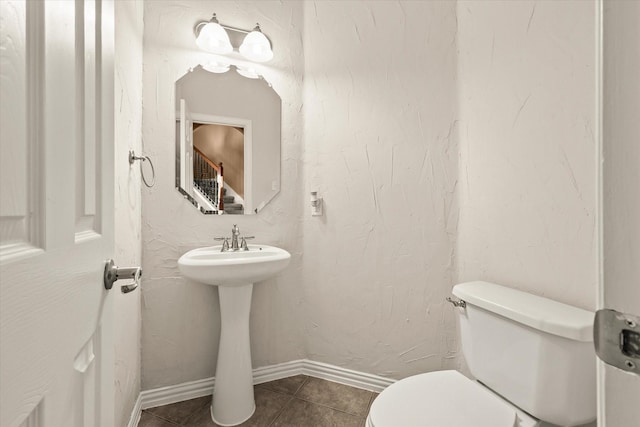 bathroom featuring tile patterned floors and toilet