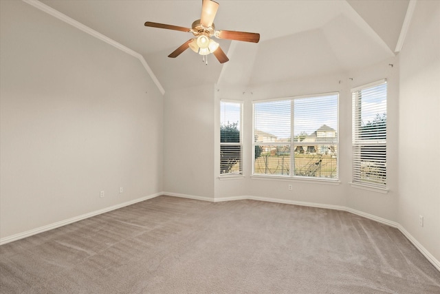 unfurnished room with ornamental molding, lofted ceiling, light carpet, and ceiling fan