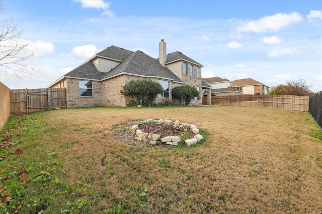 view of yard with a fire pit