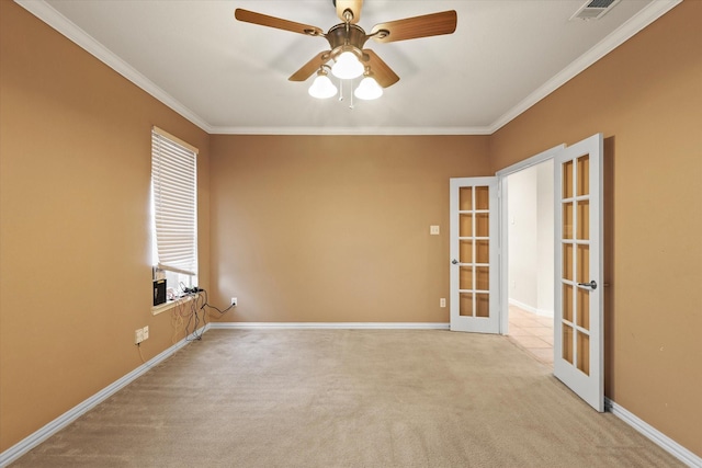 carpeted empty room with french doors, ceiling fan, and crown molding