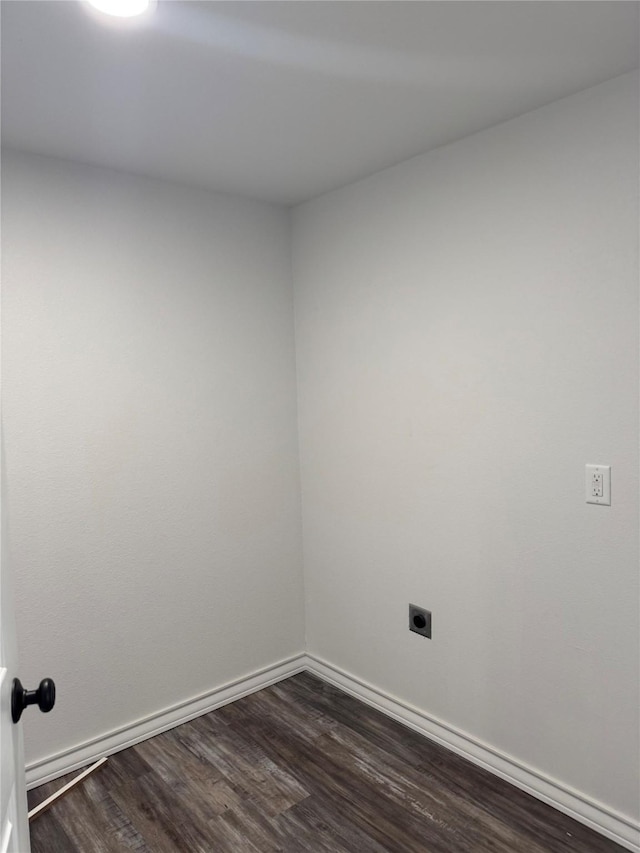 spare room with dark wood-type flooring