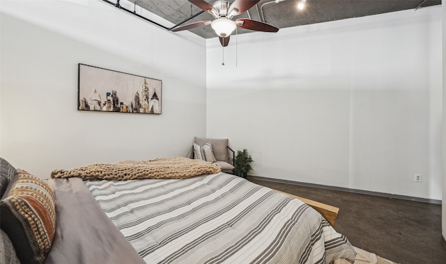 bedroom featuring ceiling fan and concrete flooring