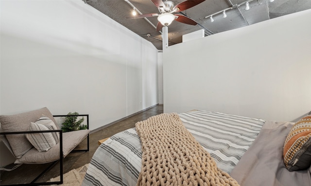 bedroom featuring ceiling fan and rail lighting