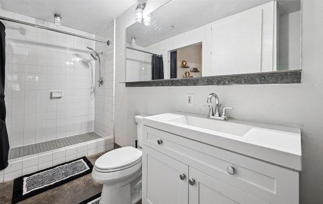 bathroom featuring vanity, curtained shower, and toilet