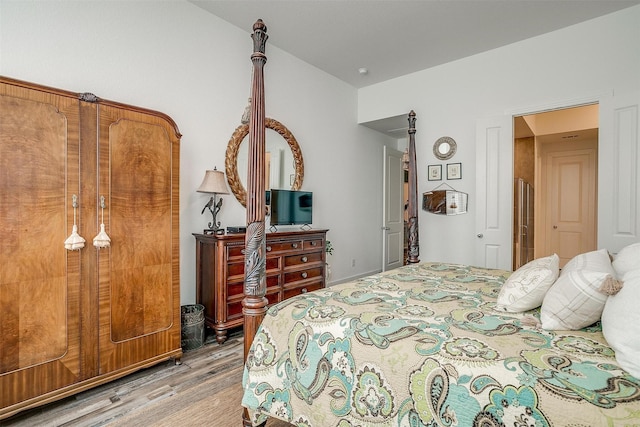 bedroom with hardwood / wood-style floors