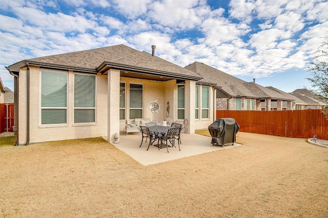 rear view of property with a patio area