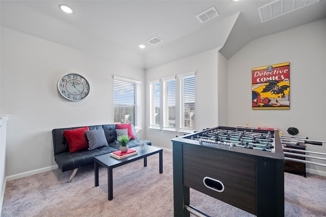 playroom featuring lofted ceiling and light carpet