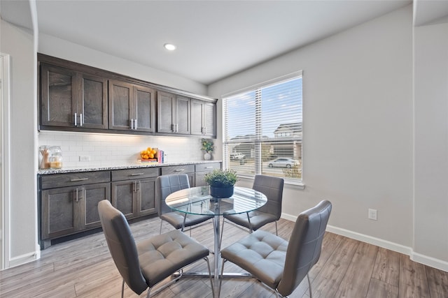 dining space with light hardwood / wood-style flooring