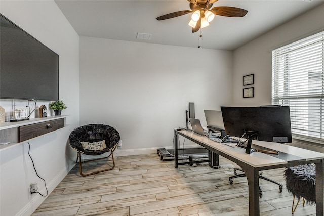 office featuring ceiling fan and light hardwood / wood-style floors