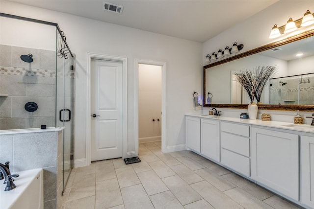 bathroom with tile patterned flooring, plus walk in shower, and vanity