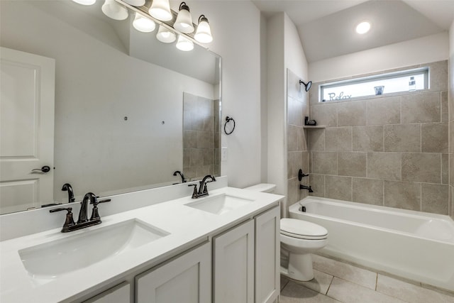 full bathroom featuring tiled shower / bath combo, vanity, a notable chandelier, tile patterned floors, and toilet