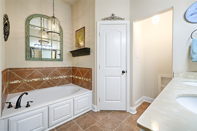 full bathroom featuring a garden tub, tile patterned flooring, a sink, baseboards, and double vanity