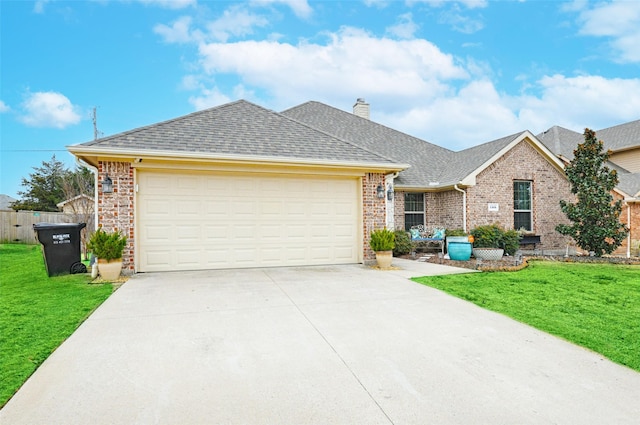 ranch-style home featuring a garage and a front lawn