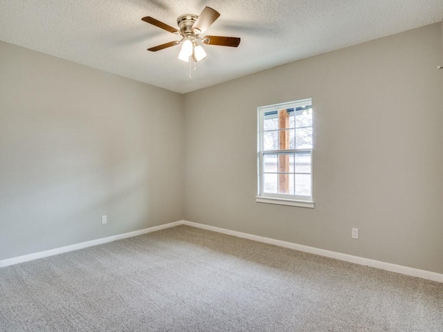 unfurnished room with carpet flooring, a textured ceiling, and ceiling fan