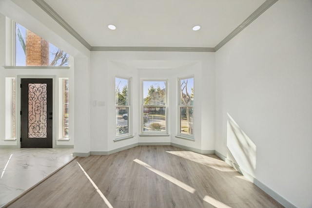 entryway with crown molding