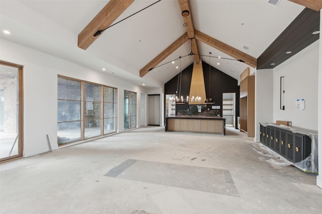 unfurnished living room featuring an inviting chandelier, high vaulted ceiling, and beamed ceiling