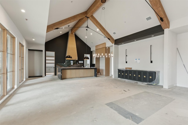 interior space with beam ceiling and high vaulted ceiling