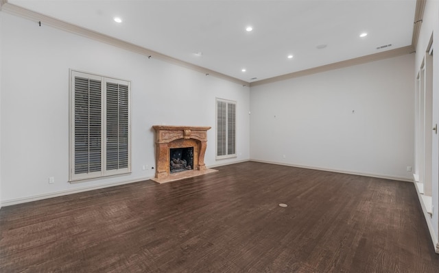 unfurnished living room with a high end fireplace, ornamental molding, and dark hardwood / wood-style floors