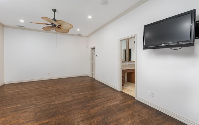 spare room featuring ceiling fan, ornamental molding, and dark hardwood / wood-style flooring