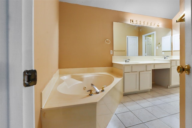 bathroom with vanity, tile patterned flooring, and a tub