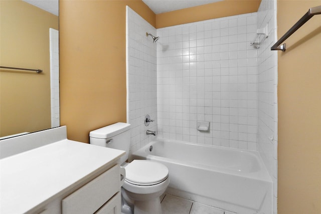 full bathroom featuring vanity, toilet, tiled shower / bath combo, and tile patterned flooring