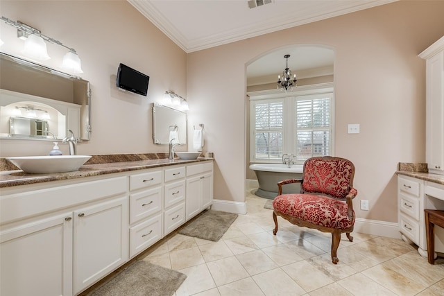 bathroom featuring a bathtub, vanity, ornamental molding, tile patterned floors, and a chandelier