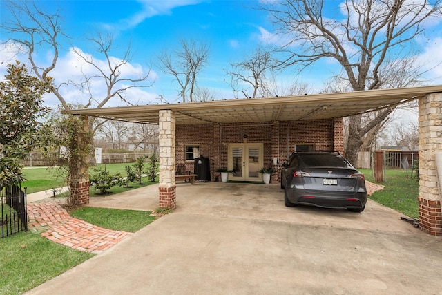 view of parking / parking lot with french doors and a carport