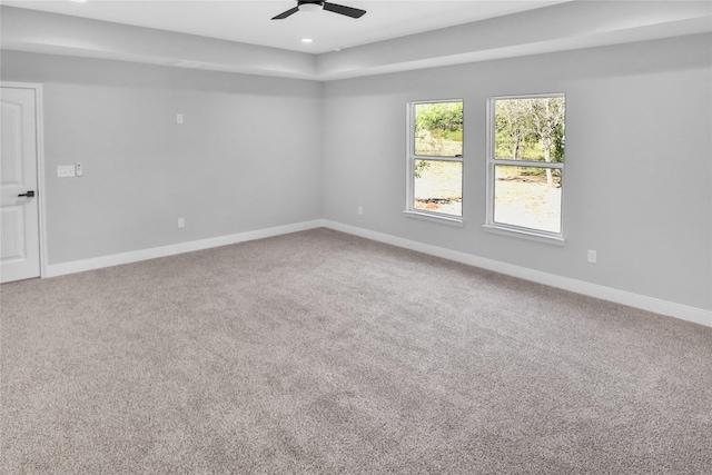 spare room with carpet floors and ceiling fan