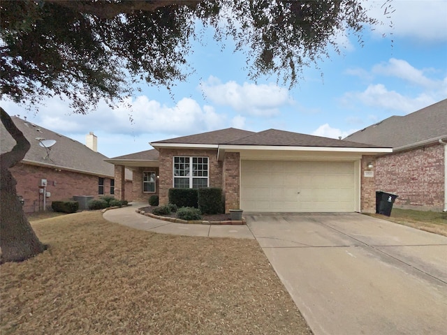 view of front of house with a garage and a front yard