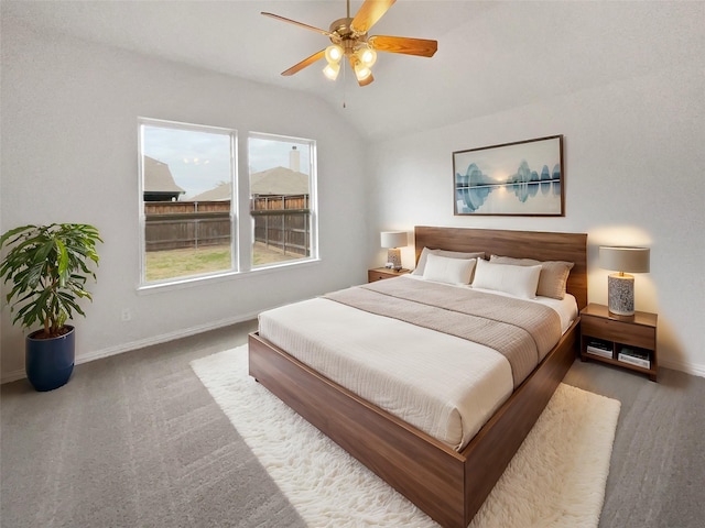 carpeted bedroom featuring ceiling fan and lofted ceiling