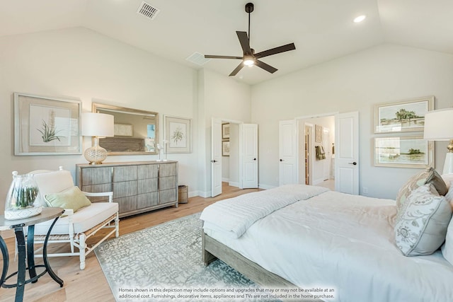 bedroom with light hardwood / wood-style flooring, ceiling fan, and vaulted ceiling