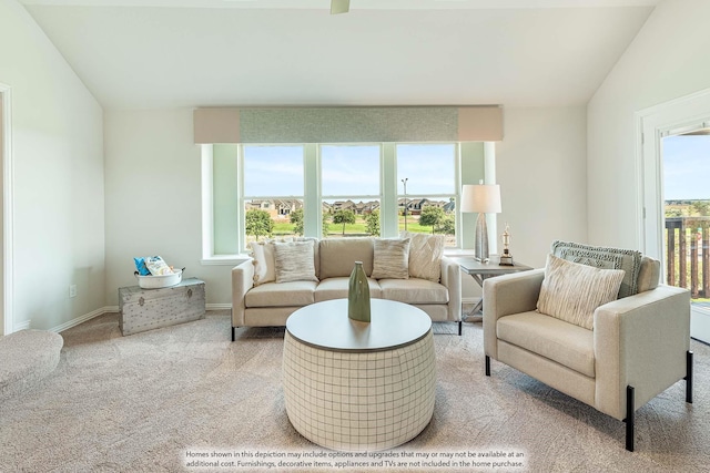 carpeted living room with lofted ceiling