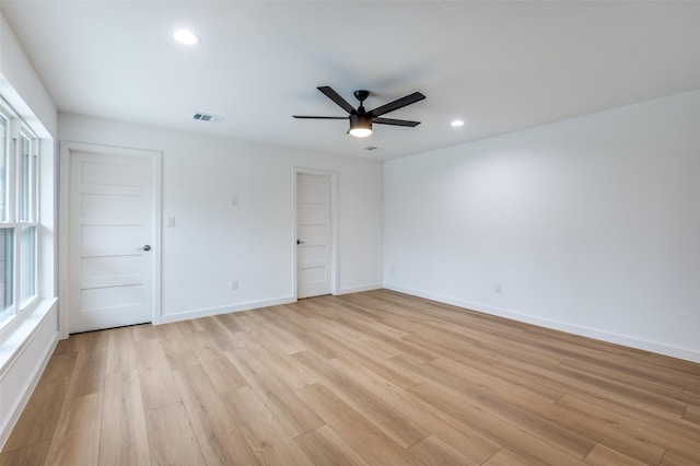 spare room with ceiling fan and light hardwood / wood-style floors