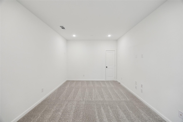 spare room with light colored carpet