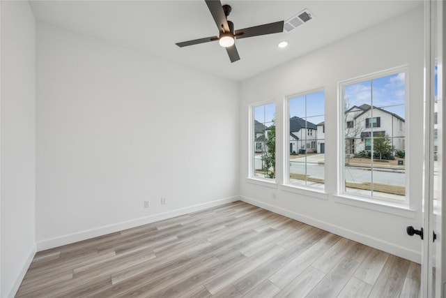 unfurnished room featuring ceiling fan and light hardwood / wood-style floors