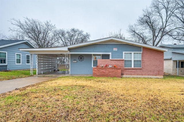 ranch-style house with a front lawn and a carport