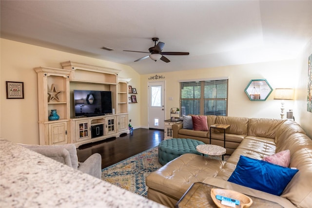 living room featuring ceiling fan and hardwood / wood-style floors