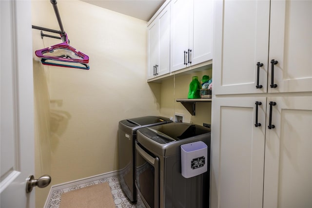 laundry area featuring cabinets and washer and dryer