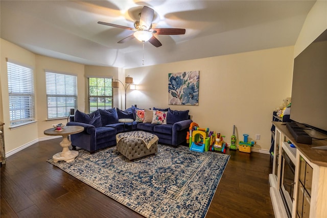 living room with lofted ceiling, dark wood-type flooring, and ceiling fan