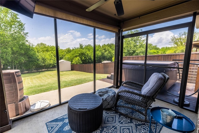 sunroom / solarium featuring ceiling fan