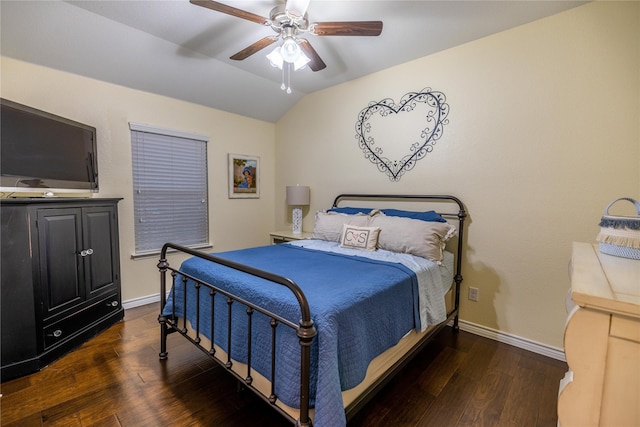 bedroom featuring ceiling fan, dark hardwood / wood-style flooring, and vaulted ceiling