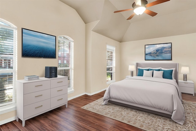 bedroom featuring ceiling fan, dark hardwood / wood-style flooring, and vaulted ceiling