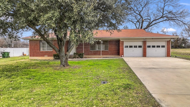 ranch-style home with a garage and a front yard