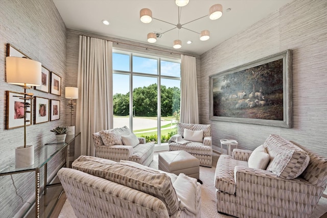 living area featuring an inviting chandelier