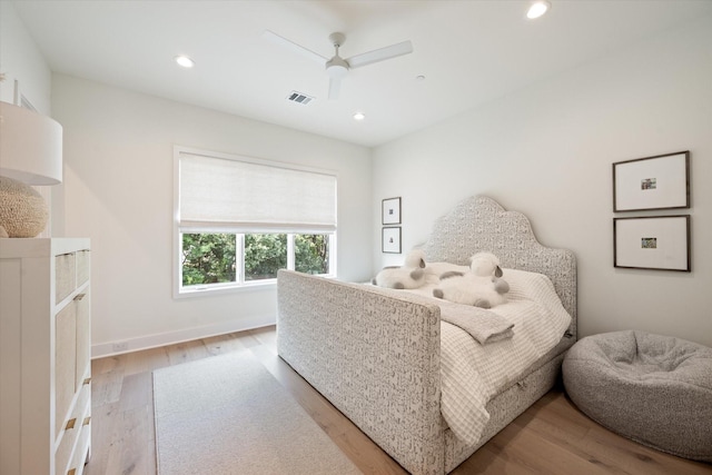 bedroom with ceiling fan and light hardwood / wood-style flooring