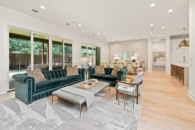 living room with light hardwood / wood-style flooring