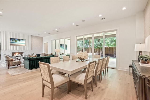 dining space with light hardwood / wood-style floors