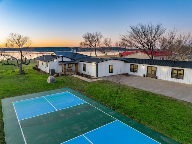 exterior space with a yard and basketball court