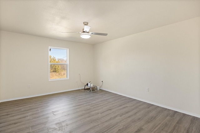 unfurnished room featuring hardwood / wood-style flooring and ceiling fan