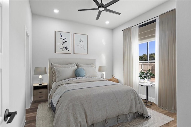 bedroom featuring hardwood / wood-style flooring and ceiling fan